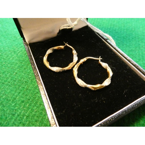 446 - Pair of 9ct gold hoop earrings