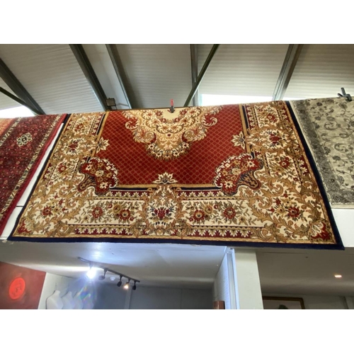 596 - Aubosson style rug with mainly red central colour  (250 x 320cm)