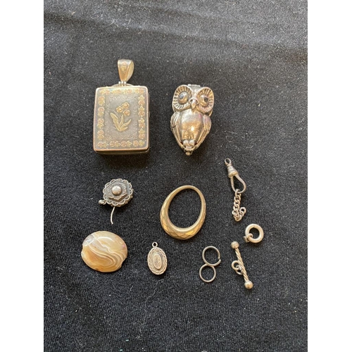 104 - Collection of mainly silver collectables inc. early silver locket, white metal owl trinket locket et... 