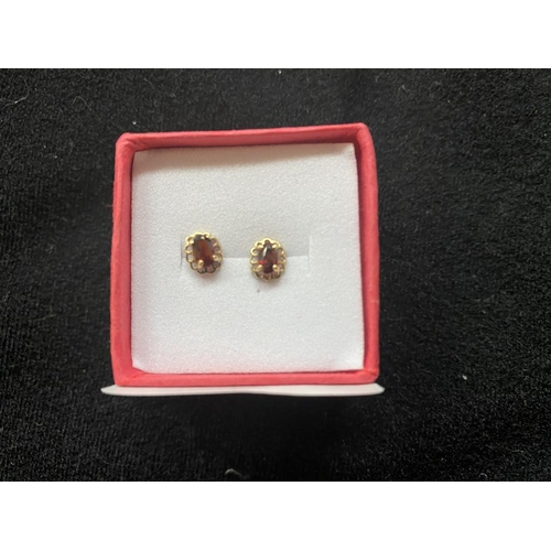 121 - Hallmarked 9ct gold garnet earrings