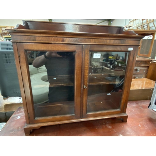 582 - Small mahogany cabinet (62H 64W 18D)