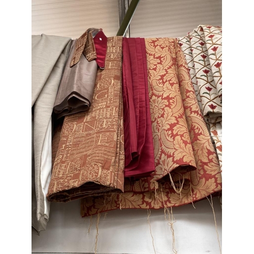 640 - Pair of orange & gold curtains with tie backs 120 wide x 230 drop cm, pair of red curtains with eyel... 