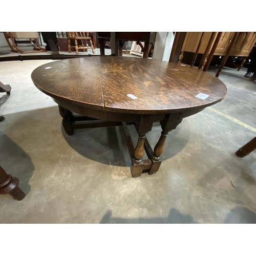 239 - Circular oak occasional table 69 diameter 30H
