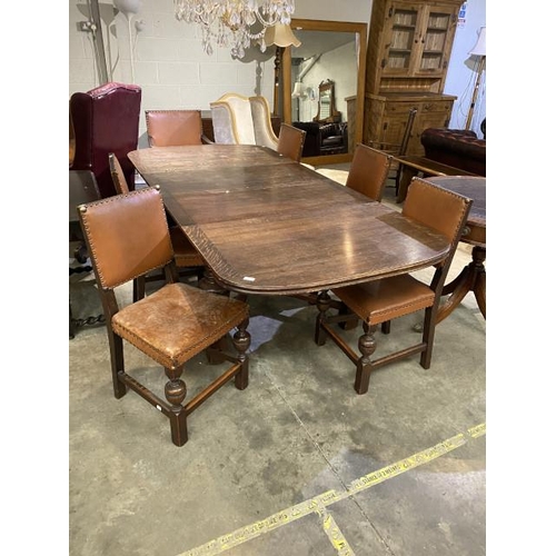 82 - Oak extending dining table (74H 227W 106D cm) & 6 chairs