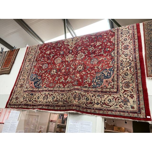 Red ground Persian carpet (415 x 310 cm)