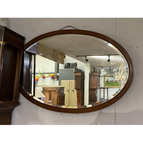 150 - Edwardian mahogany inlaid oval mirror (60x90cm)