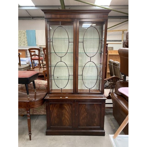 165 - Rackstraw mahogany glazed bookcase on cupboard (210h x 105w x 41d cm)