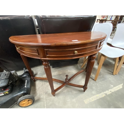 181 - Mahogany single drawer demi lune table (75H 109W 45D cm)