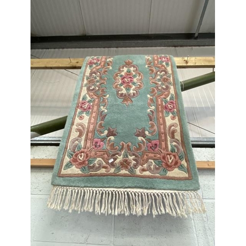 18 - Green ground Chinese style rug 155 x 79cm