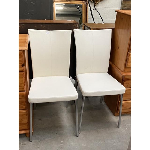 33 - Pair of white leather side chairs