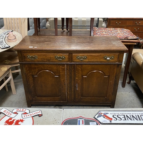 220 - Early oak 2 door sideboard with 2 keys (86H 122W 46D cm)