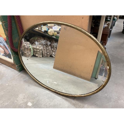 295 - Oval mahogany gilt painted bevel edged mirror (90x64cm)