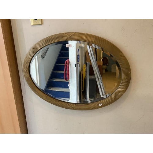 353 - Oval gilt framed bevel edged mirror (86x62cm)