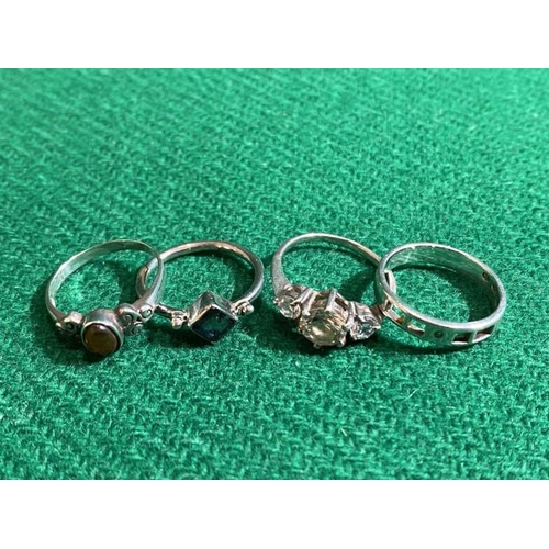 359 - 4 Silver rings inc. amber (Sizes Q, P, M & N)