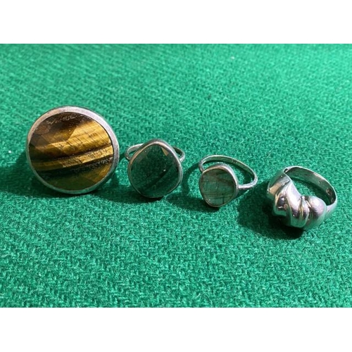 381 - 4 silver rings inc. tigers eye (Sizes M, 2 N's & O)