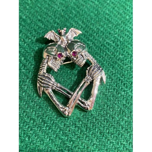 395 - Silver skeleton & bat brooch