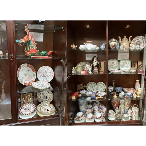 468 - 11 Mixed shelves of oriental wares inc. teapots, vases, ginger jars, plates, folding screens, tea bo... 