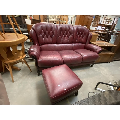 67 - Italian burgundy leather 3 seater settee (180W cm) & matching footstool (36H 53W 53D cm)