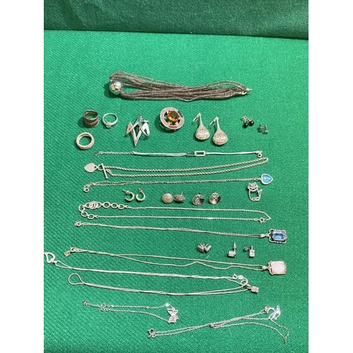 333 - Box of various silver jewellery including necklaces, pendants, cat brooch, earrings, butterfly brace... 