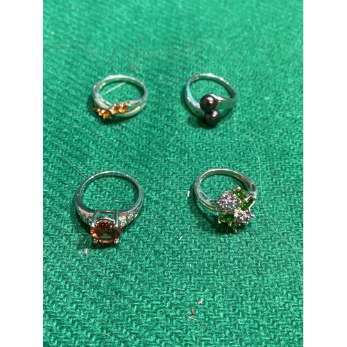 338 - 4 Silver rings inc. black pearl, CZ etc (Sizes L, Q, Q1/2 & R)