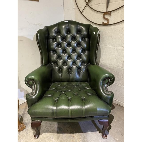 110 - Green leather button back Chesterfield wing armchair (85W cm) (1 button will require attention)