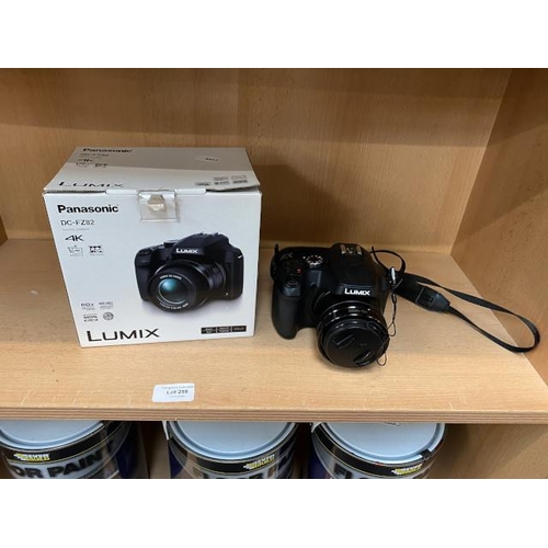 258 - Boxed Panasonic Lumix model no. DC-FZ82 camera, lens cover & USB lead/plug