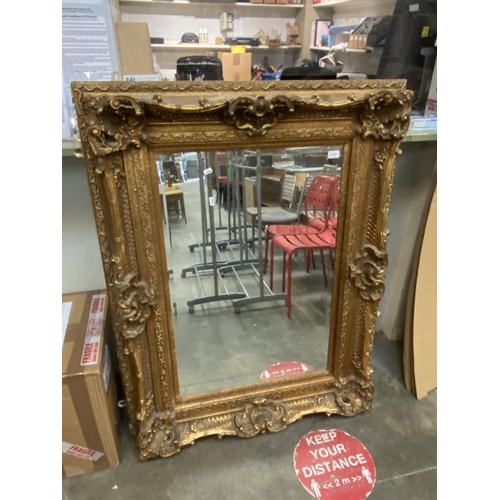 275 - Ornate gilt framed bevel edged mirror (98x129cm)