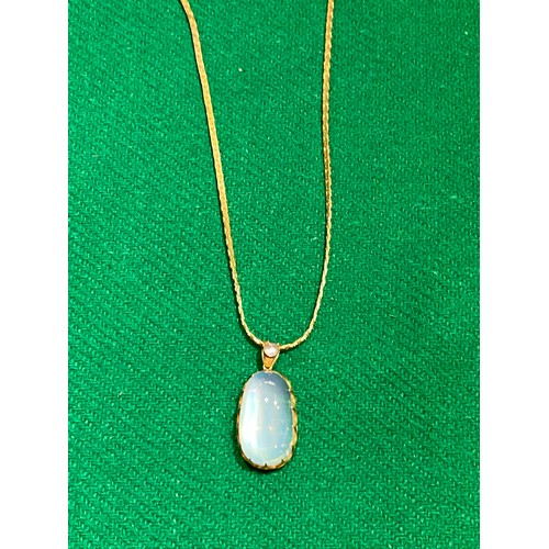 282 - Vintage gilt moonstone pendant on gilt chain (no hallmarks)