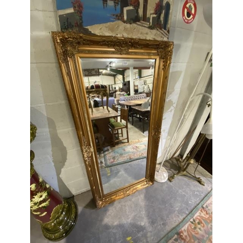 142 - Gilt framed bevel edged wall mirror (160x84cm)