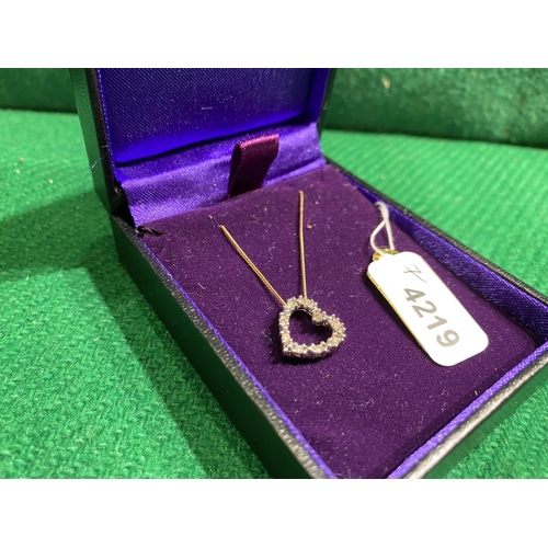 332 - 9ct Gold heart necklace. Clear stones tested as diamond