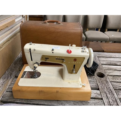 92 - Cased Singer 237 sewing machine with foot pedal