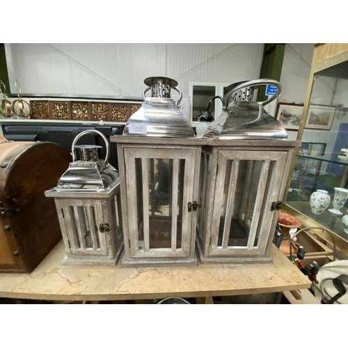 233 - Pair of chrome topped candle lanterns (48H cm) & matching smaller one (30H cm)