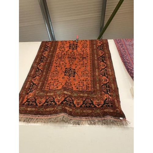 438 - Red ground Persian rug (195h x 123w cm)