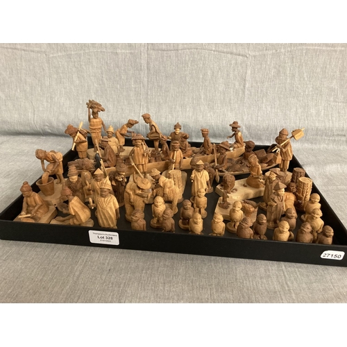 328 - Approximately 50 carved African figurines/ boats (One figurine as seen)