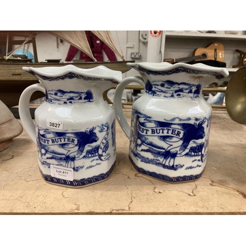 411 - Two blue & white milk jugs