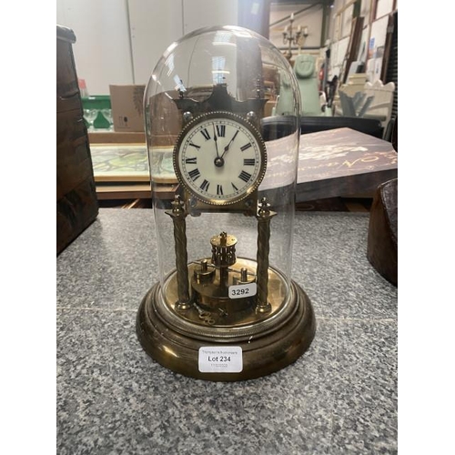 234 - Brass anniversary clock with glass dome (as seen - pendulum damaged)