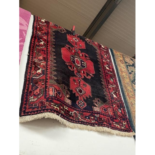 77 - Red ground Persian rug 160 x 110cm