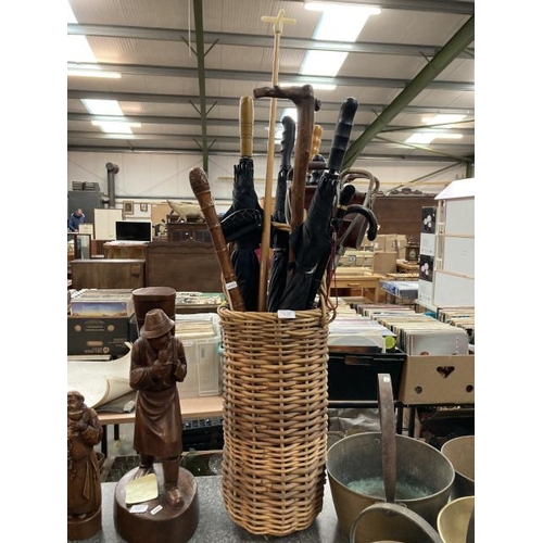 228 - Wicker stick stand, 2 shooting sticks, 6 umbrellas, 5 walking sticks etc