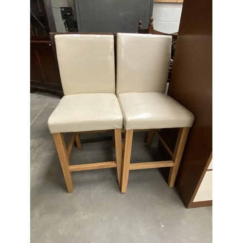 27 - Pair of cream faux leather bar stools (40W cm)