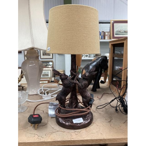 483 - Resin boxing hares table lamp with mustard coloured shade