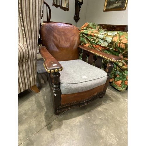 91 - Edwardian oak and leather armchair 68W