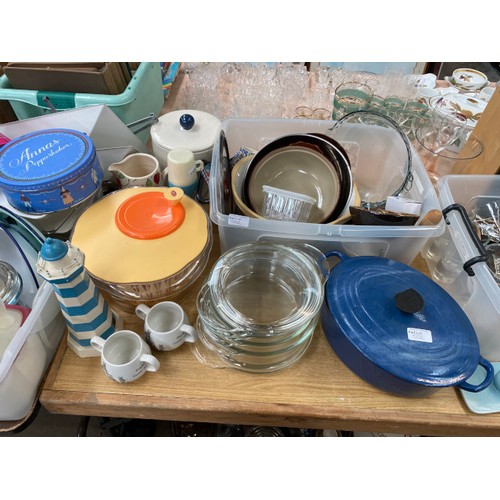 552 - Collection of kichenalia, incl enamel plates, salad spinner, glass casserole dishes, Le Cruset casse... 