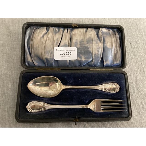 255 - Cased silver spoon & fork (engraved F Young 1902)