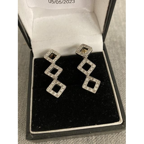 284 - 9ct white gold drop earrings with clear stones (hallmarked)