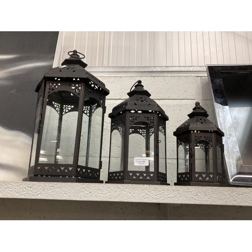 326 - 3 black metal graduated candle lanterns