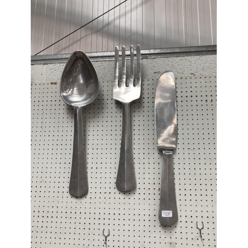 348 - Hanging metal knife, fork & spoon 59cm tall