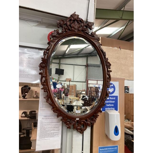 294 - Regency style mahogany carved oval bevel edged mirror 110x68cm