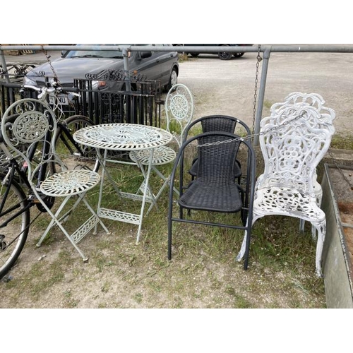 663 - Metal folding bistro table 74H 72W 53D and 2 chairs. Pair of black garden chairs 52W and a pair of m... 