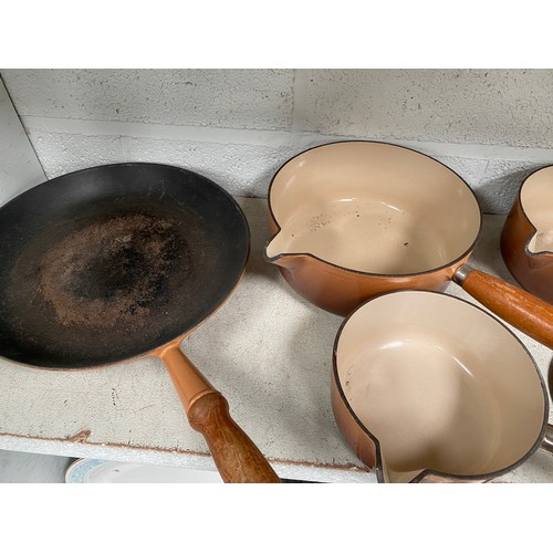 447 - 6 piece brown Le Creuset cookery set (frying pan & 5 graduated lidded pans)