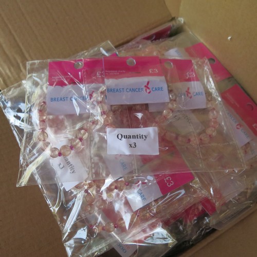 488 - 3 boxes of approximately 369 pink bracelets